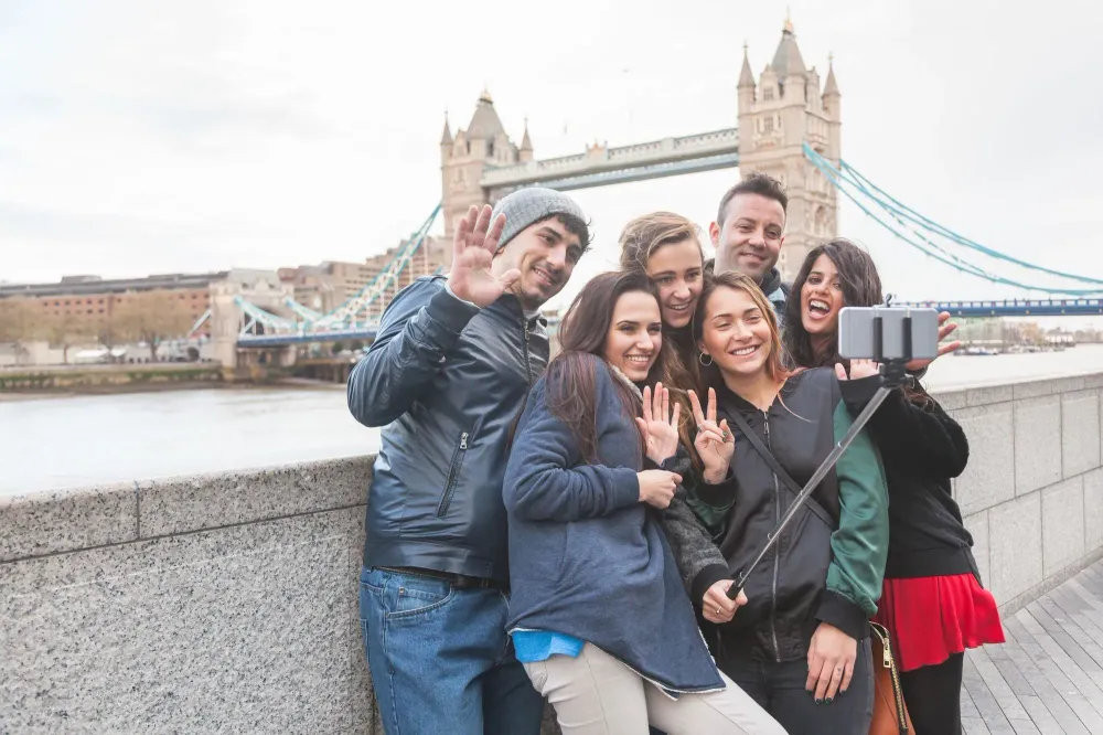 Group of friends taking a selfie in front of the Tower of London